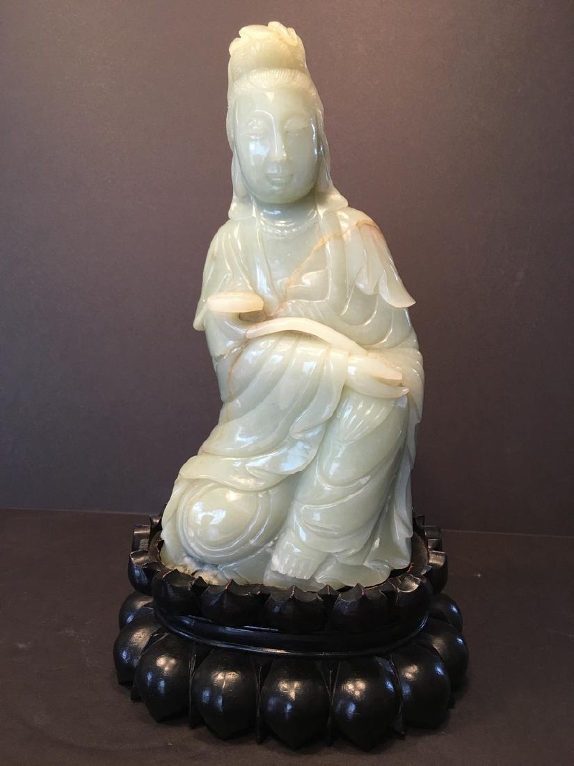 ANTIQUE Large Chinese Celadon White Jade Guanyin: ANTIQUE Large Chinese Celadon White Jade Guanyin seating on a wood stand, Qing Dynasty. 12" x 6" wide