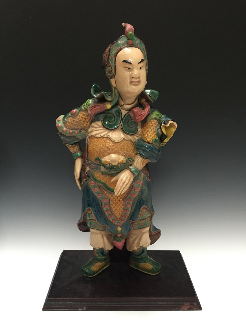 A CHINESE ANTIQUE POLYCHROME DECORATED FIGURE (1 of 4)