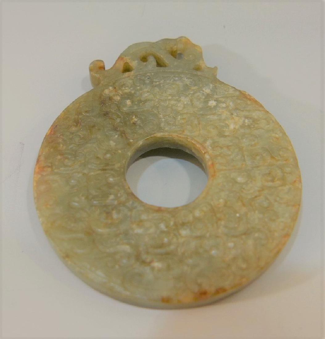 CHINESE ANTIQUE JADE BI - WESTERN HAN DYNASTY: CHINESE ANTIQUE JADE BI - WESTERN HAN DYNASTY. 35 GRAMS 5.6CM WIDE. PROVENANCE - BETHESDA MD ESTATE