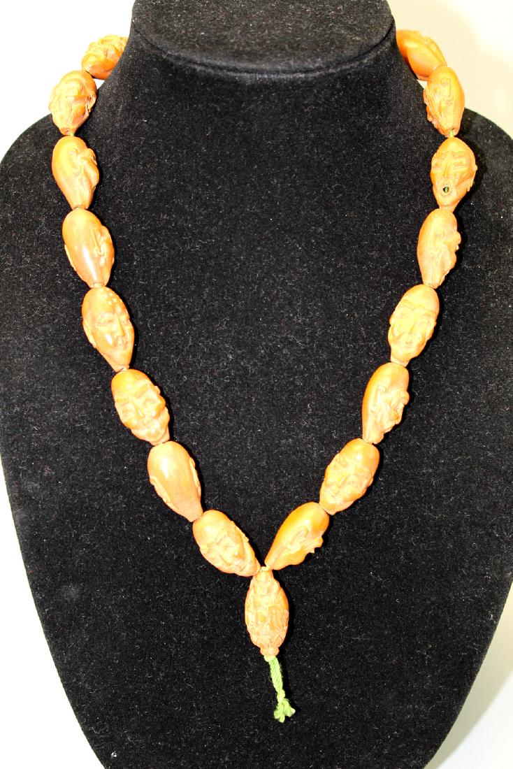 Chinese carved nut bracelet. (1 of 3)