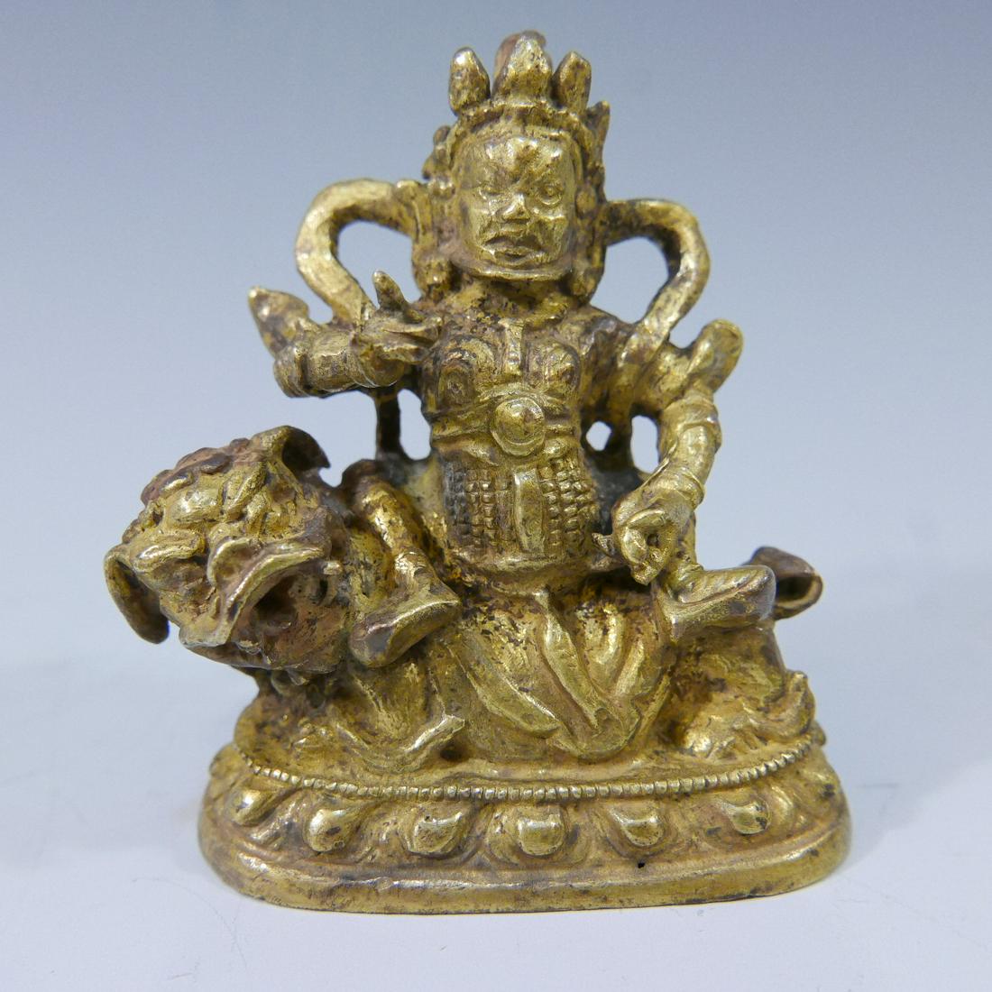 SMALL SINO TIBETAN GILT BRONZE BUDDHA RIDING LION- (1 of 7)