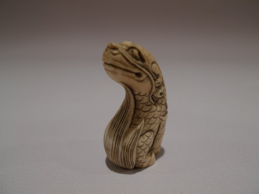JAPANESE CARVED IVORY BEAST NETSUKE MEIJI PERIOD: JAPANESE CARVED IVORY NETSUKE MEIJI PERIOD. MYTHICAL BEAST 2"