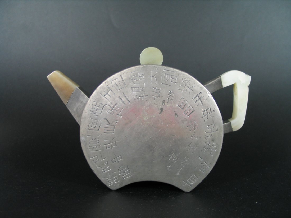 Antique Chinese Yixing Teapot with Tin Decoration: Antique Chinese Yixing Teapot with Tin Decoration, Daoguang Period, Made by Fan Luzeng, Marked, Jade handle, spout and cover tip. Ht: 4 inches. Width: 6 inches.