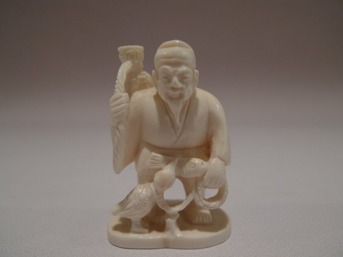 JAPANESE CARVED IVORY PEASANT NETSUKE MEIJI PERIOD: JAPANESE CARVED IVORY PEASANT NETSUKE MEIJI PERIOD. 2"