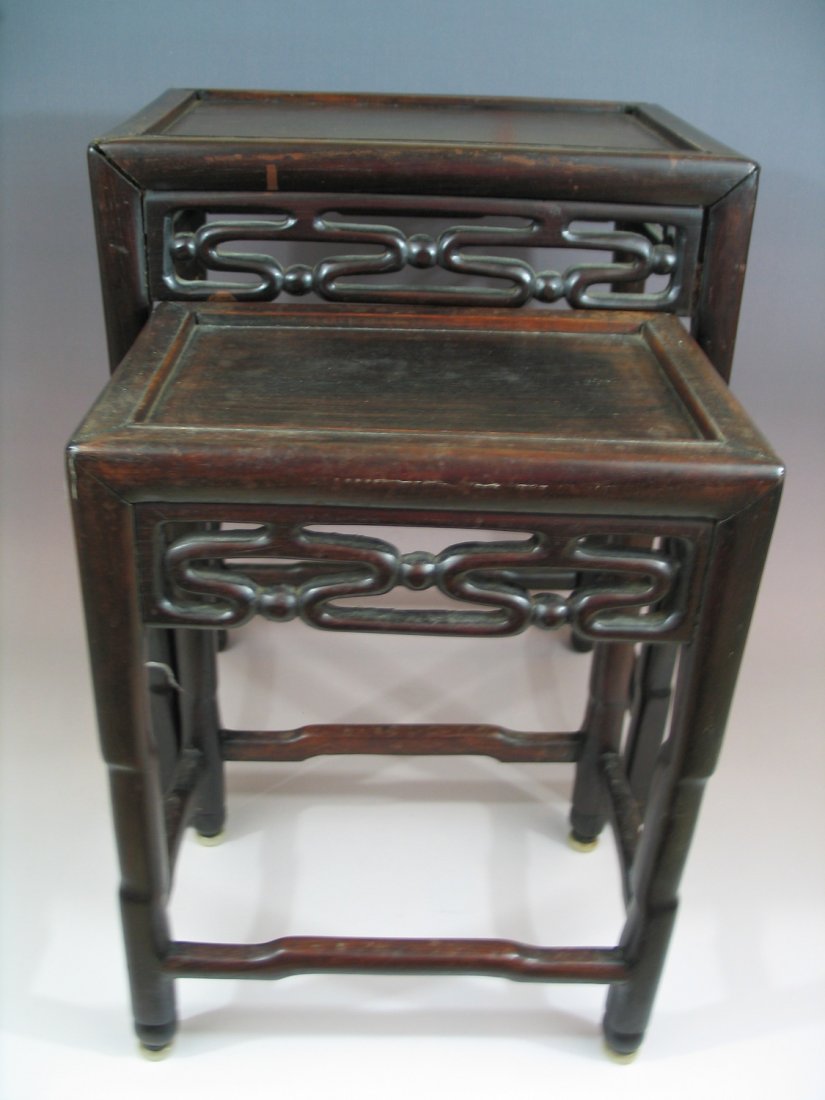 Two Chinese Rosewood Nesting Tables: Two Chinese Rosewood Nesting Tables. Rectangular paneled top. Size: 20" X 15" X 10.5".