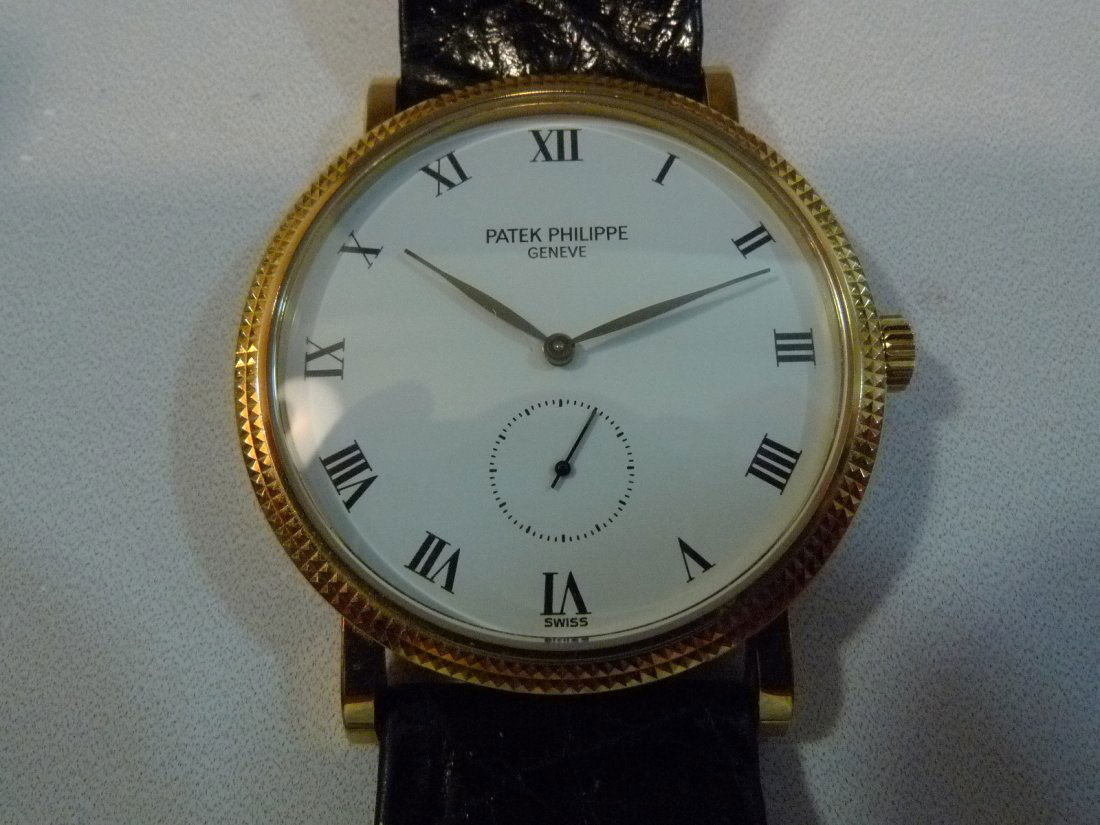 PATEK PHILIPPE 3919 MENS 18K GOLD WATCH PAPER ALL: PATEK PHILIPPE 3919 MENS 18K GOLD WATCH PAPER. ALL ORIGINAL PATEK PHILIPPE STRAP AND 18K PATEK PHILIPPE BUCKLE. ORIGINAL PAPERWORK. MODEL 3919. SUPER THIN. MANUAL WIND MECHANICAL MOVEMENT. RECENTLY SE
