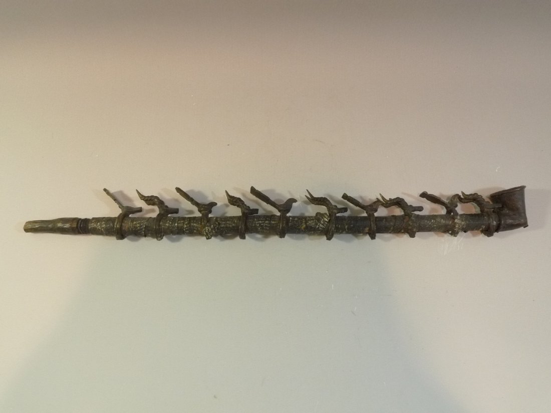 ANTIQUE AFRICAN ANIMAL TRIBAL BRONZE PIPE WITH LEATHER: ANTIQUE AFRICAN ANIMAL TRIBAL BRONZE PIPE WITH LEATHER WRAPPING. 55 CM LONG
