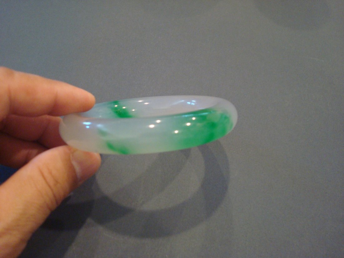 OLD Chinese Green Jade (Fei Cui) Bangle: Old Chinese Green Jade (Fei Cui) Bangle.Size: 3 3/8" outer diameter; Inner diameter: 2 3/8"