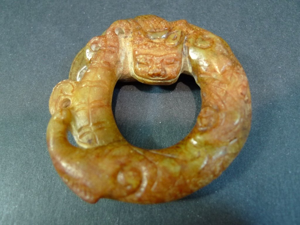 ANTIQUE CHINESE HETIAN JADE RING - HAN DYNASTY: ANTIQUE CHINESE HETIAN JADE RING - HAN DYNASTY. 6.5CM WIDE. 84 GRAMS. THE DR. HELGA WALL-APELT COLLECTION.