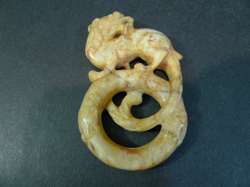 ANTIQUE CHINESE HETIAN JADE RING - HAN DYNASTY: ANTIQUE CHINESE HETIAN JADE RING - HAN DYNASTY. 8.6CM LONG. 77 GRAMS. THE DR. HELGA WALL-APELT COLLECTION.