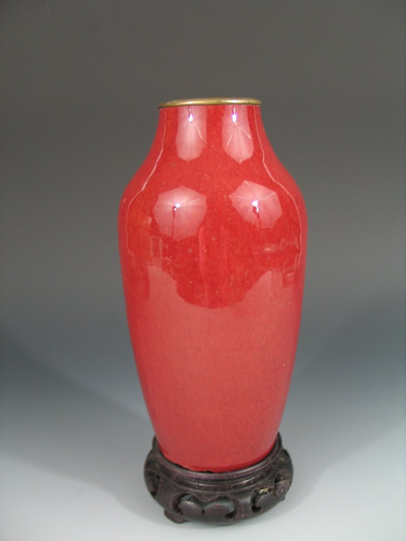 Chinese Sang De Beuof Porcelain Vase: Chinese Sang De Beuof Porcelain Vase. Qing Dynasty Ht: 7 1/2 inches. Metal rim mounting. Stand is not included for sale.