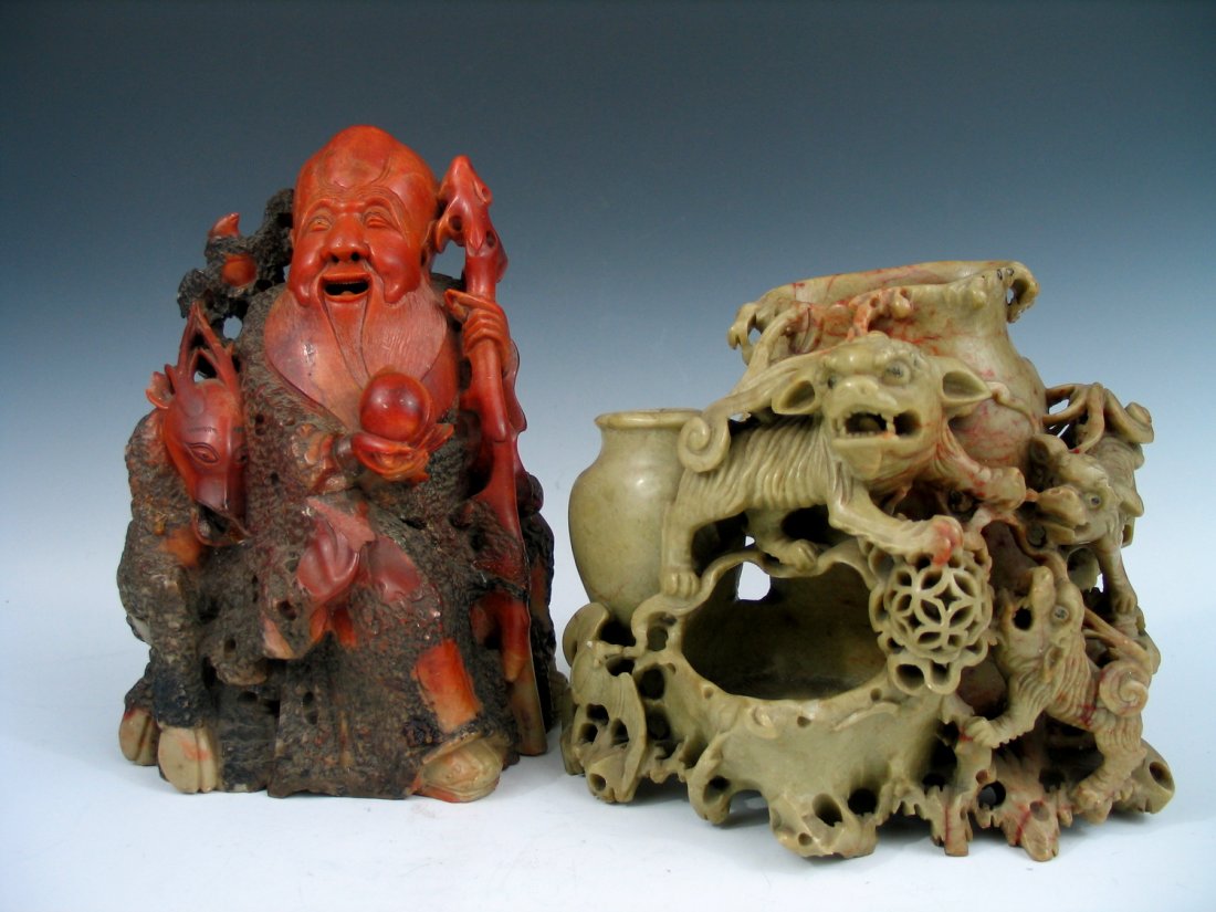 Two Soapstone Carvings of Shoulao and Foo Dog.: Two Soapstone Carvings of Shoulao and Foo Dog. Shoulao ht 25 cm. Foo dog ht 19 cm.