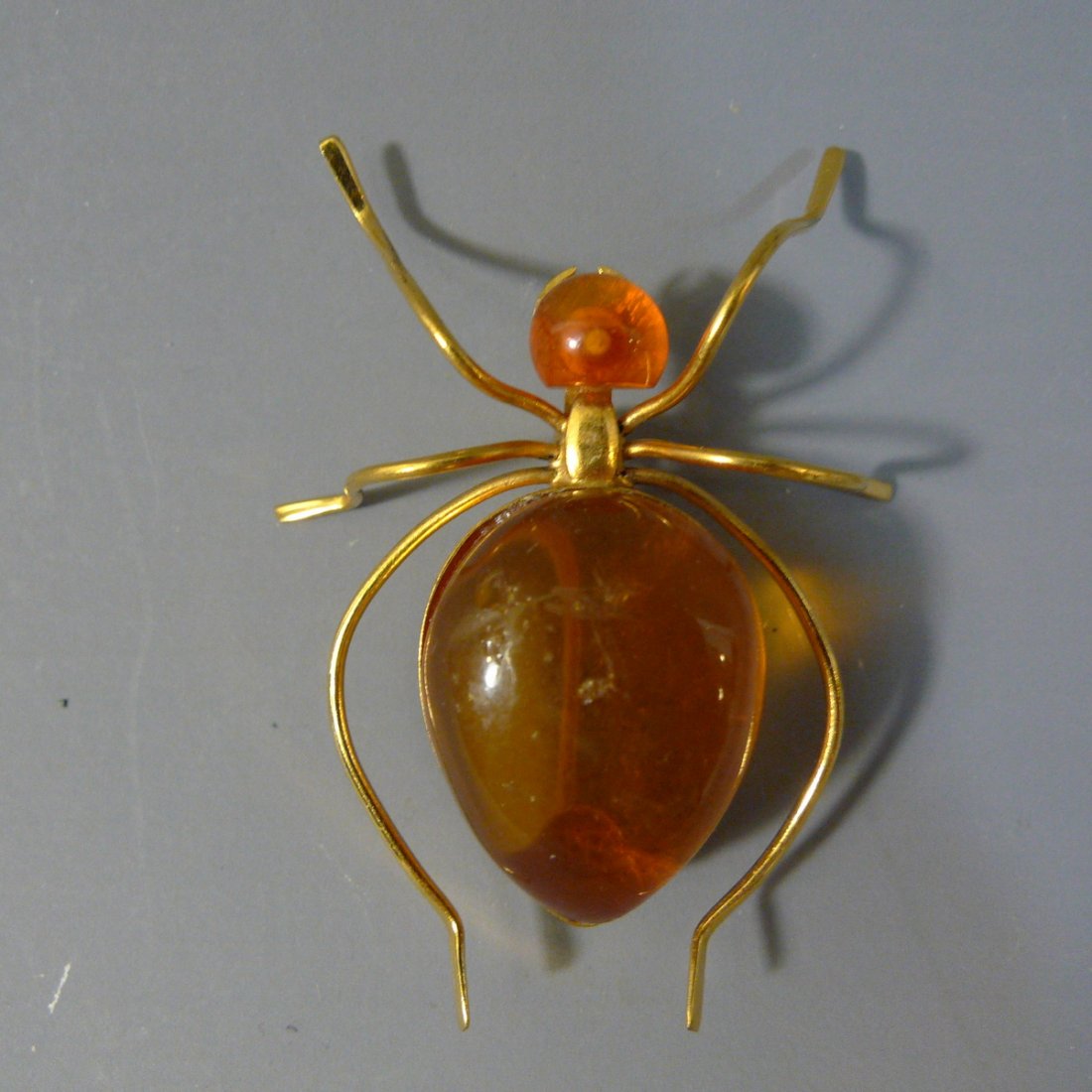 MARKED AMBER SPIDER PIN (1 of 9)