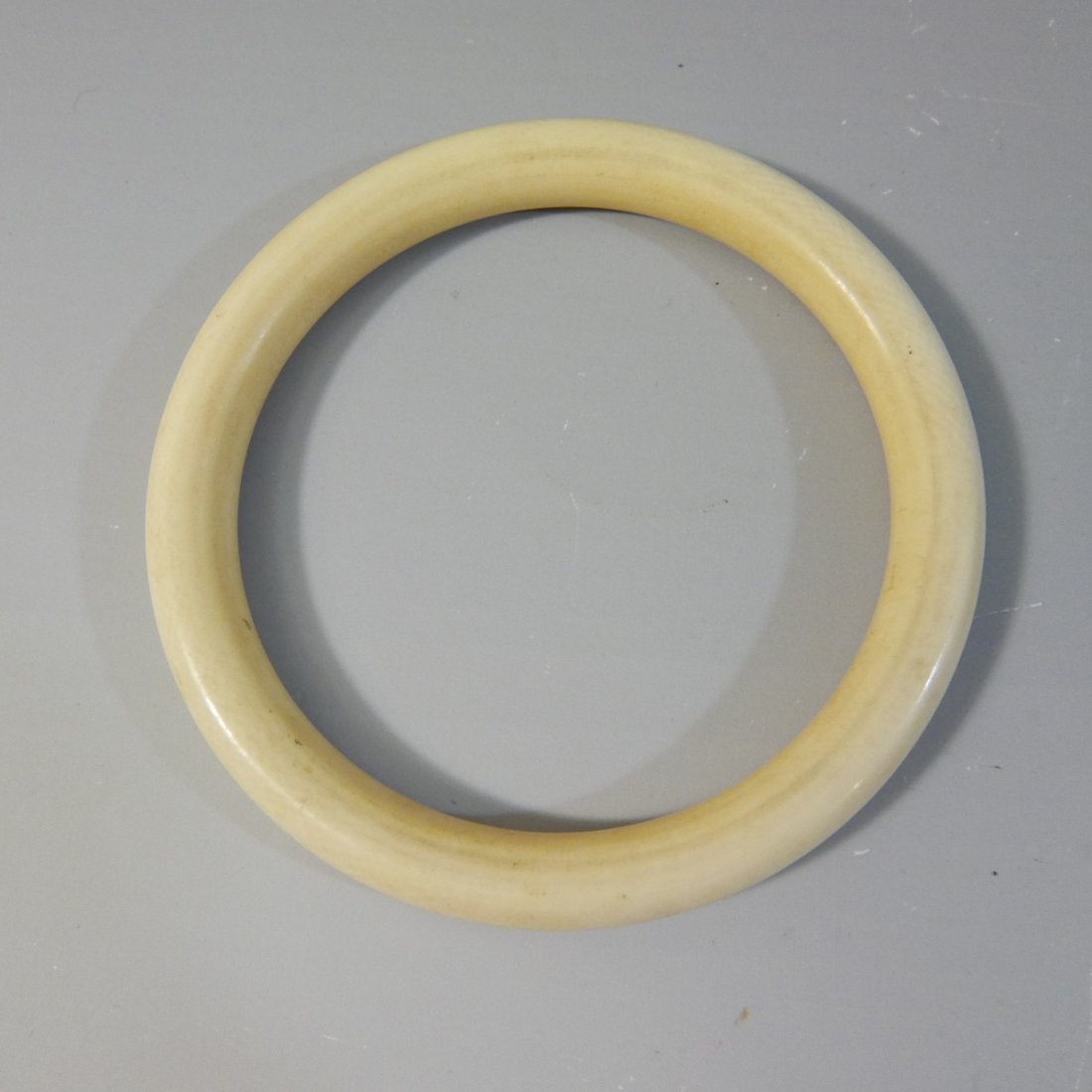 CHINESE CARVED BANGLE BRACELET - CIRCA 1920S (1 of 5)