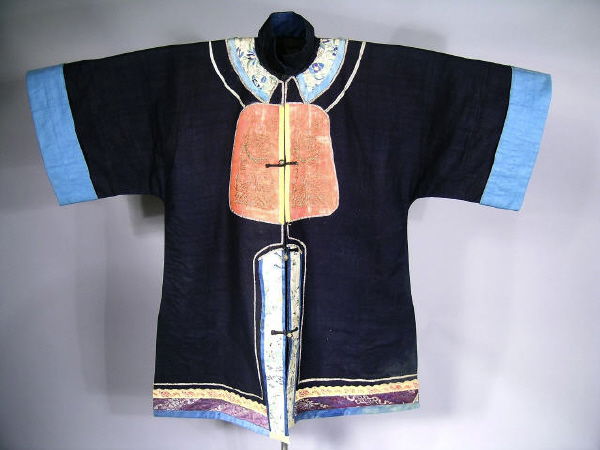 Chinese Jacket Vintage Embroidery: Lovely antique Chinese Peasant Jacket, presented as a work of art on a custom made stand. Beautiful cotton fabric with appliqued designs embroidered in traditional symbols. Metal frog closures. Jacket