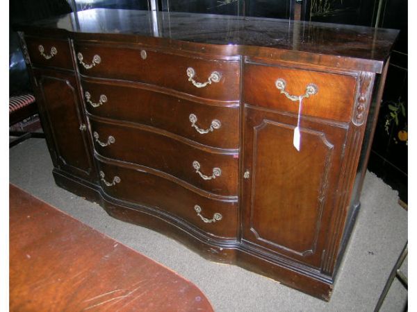 Duncan Phyfe Mahogany Buffet: Buffet with serpentine front, four drawers down the center, flanked by short drawers over cupboard on each side. Needs touch up, veneer chips.. 34.5" H x 60" W x 21.5" D.