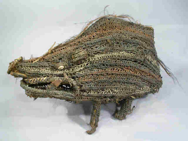 Sepik River New Guinea Pig Tribal Art Antique: Yes, a New Guinea Pig, except its old. Sepik River Plaited fiber boar has wood tusks, cowrey shell eyes, feathers, bamboo armature. Red, grey and white paint remains. Hump back, small legs, hollow int