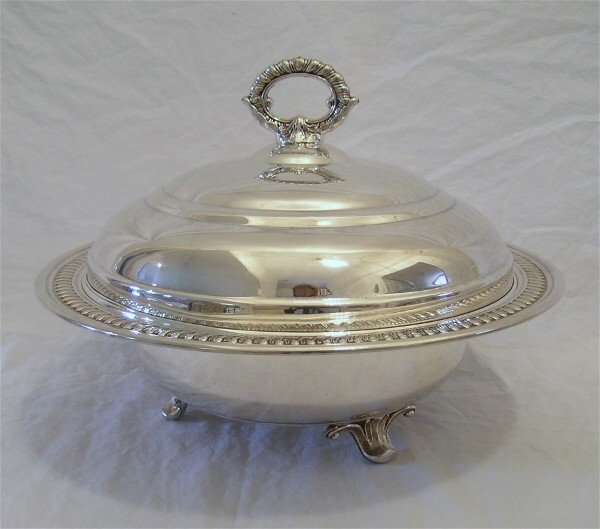 Covered Casserole Silverplate 12": Covered Footed Casserole; American silverplate covered casserole designed for Pyrex liner, has domed lid. Gadroon border, on scrolled feet. Marked SILVERPLATE. 9" high X 12" diameter.
