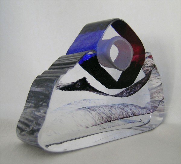 In The Stone Art Glass mini sculpture: Another of the Mysterious Envoys tablesculpture collection by Bertil Vallien for Kosta Boda, depicting a mountain peak, with sedimentary layers in graduating thicknesses, purple and blue. Titled "In t