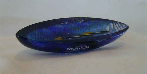 Journey Art Glass Boat B.Vallien: Jouney, one of the most sought after Mysterious Envoys by Bertil Vallien for Kosta Boda. Beautiful blue canoe, the outer edges ribbed, embedded is a twist of white and black with yellow accents. Signe