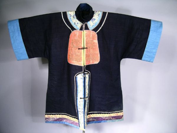 Chinese Jacket Vintage Embroidery: Lovely antique Chinese Peasant Jacket, presented as a work of art on a custom made stand. Beautiful cotton fabric with appliqued designs embroidered in traditional symbols. Metal frog closures. Jacket