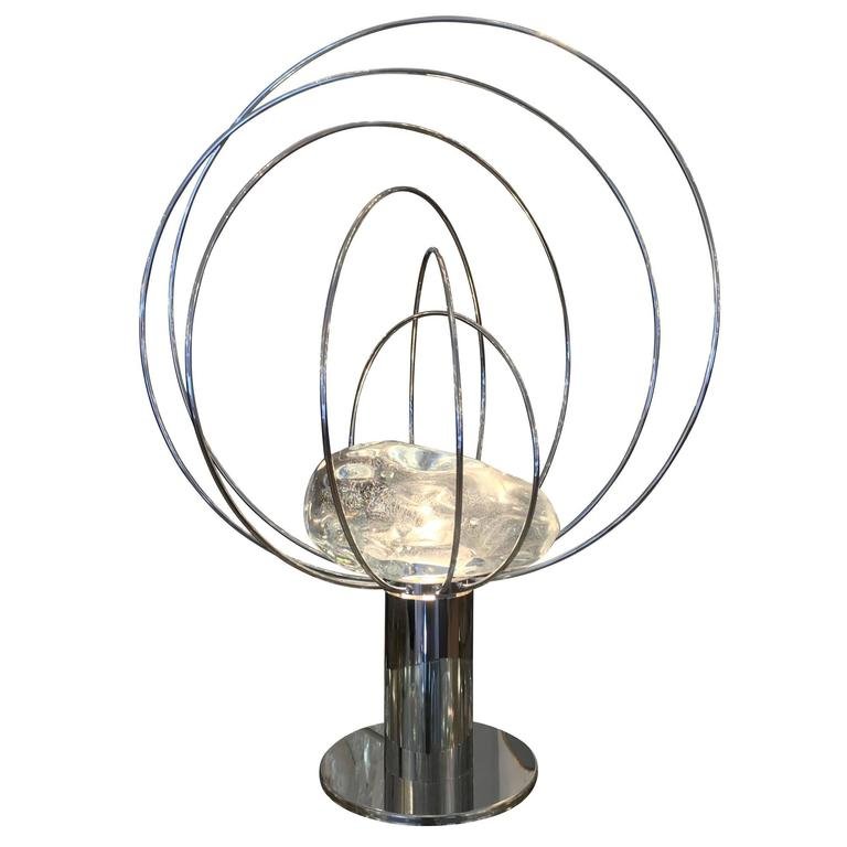 Angelo Brotto, Esperia, Barnaba lamp: Original stunning nickel-plated table lamp designed by Angelo Brotto in the 1960s for Esperia. It features handmade glass amber incased in a circular "cage". The light bulb underneath the glass amber