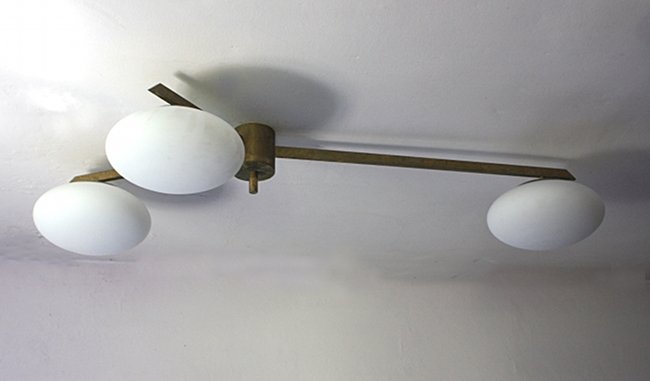 Angelo Lelii, ArredoLuce, chandelier: Chandelier, brass structure, white glass diffusors. Angelo Lelii, ArredoLuce, 1950 ca. Dimensions: 135 x 68 cm Lampadario, struttura in ottone, diffusori in vetro bianco. Angelo Lelii, ArredoLuce, 195