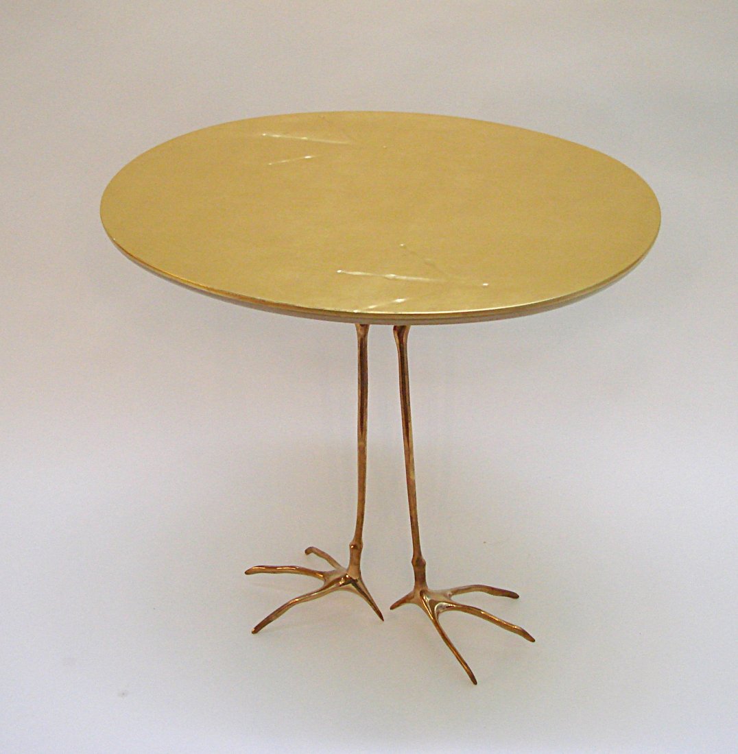 Oppenheim M., table Traccia: M. Oppenheim. Table. Ellictical plane with pure gold leaf. Fusion bronze legs. Oppenheim by M. Oppenheim, Traccia model. Prod. Simon Gavina 1932, riproduction on 1972. Dimensions: h 65, 68 x 53 cm.(h