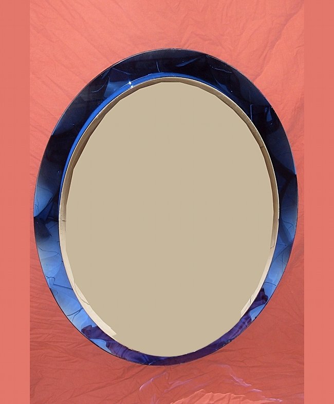 Cristal Art, wall mirror: Cristal Art, wall mirror; grinded blue glass frame. 1950 ca. CristalArt Specchiera con cornice in vetro blu molato e specchiato. Scrostature sulla cornice. 1950 circa. Dimensioni: h 90 x 65 cm
