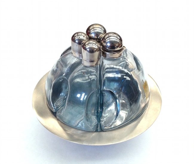 Arnolfo di Cambio, condiment set: Condiment set. Steel, crystal. Arnolfo di Cambio, 1970 ca.Edoardo Dal Seno. Acetoliera. Acciaio, cristallo. Dimensioni: diametro 17,5 cm (6,88\"), h 15 cm (5,9\"). Prod. Arnolfo di Cambio, 1970 ca . C