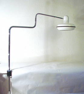 Bilumen, Sergio Asti, table lamp: Table lamp with clamp. Girotondo model. Chromed metal adjustable arm. Adjustable varnished metal reflector. Dimensions:h 35,4'', max 31,5''.Sergio Asti, Prod. Bilumen, 1974. Bibliografia: Rivista Domu