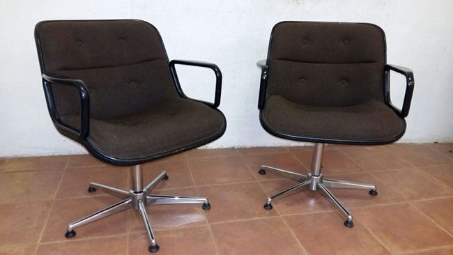 Charles Pollock, two armchairs: Very nice executive armchairs designed by Charles Pollock for Knoll in 1956, in black leather upholstery with black arms on a four star stainless steel swivel base with resin casters. Height 31-36", s