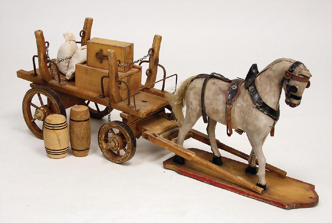 draft horse, wood, pelt covered, pelt losing, original: draft horse, wood, pelt covered, pelt losing, original bridle, mounted on a wooden board, without rolls, 29 cm, with cart German Description Zugpferd, Holz, Fell bezogen, Fell ausgegangen, Orig.-Zaumz