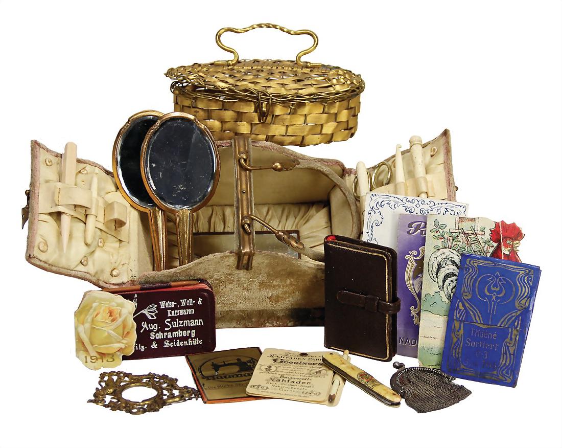 small velvet suitcase about open, inside sewing: small velvet suitcase about open, inside sewing accessories, crochet hook and other things made of ivory, with some old needle cases, paper, 2 hand mirror, small notebook, 1 prayer book, 1 oval basket