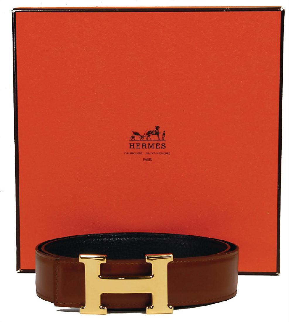 HERMÈS belt, model: H, calf leather, color:: HERMÈS belt, model: H, calf leather, color: brown/black, gold colored H-buckle with Hermès engraving, reversible belt, lenght: c. 94 cm, width: c. 3.3 cm, with original box and small dus
