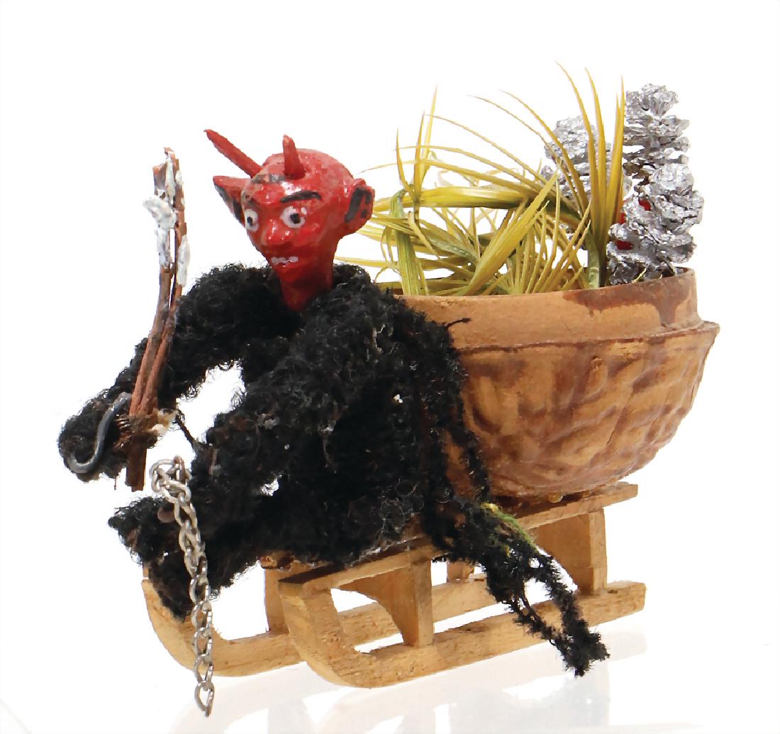 Christmas tree decoration, Krampus on a sledge, with: Christmas tree decoration, Krampus on a sledge, with half nut, height: 6 cm German Description Christbaumschmuck, Krampus auf Schlitten, mit Halbnuss, H: 6 cm