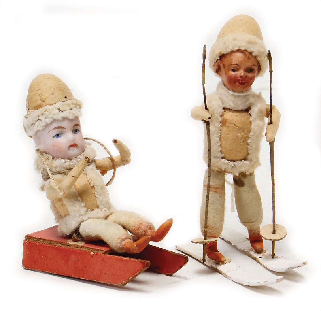 child on sledge, bisque head, 1 child on skis, mass (1 of 1)