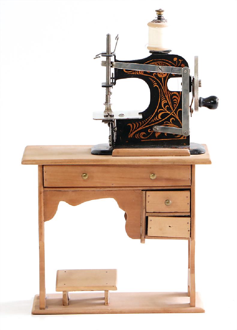 MÜLLER sewing machine, No. 0, on a wooden table, (1 of 1)