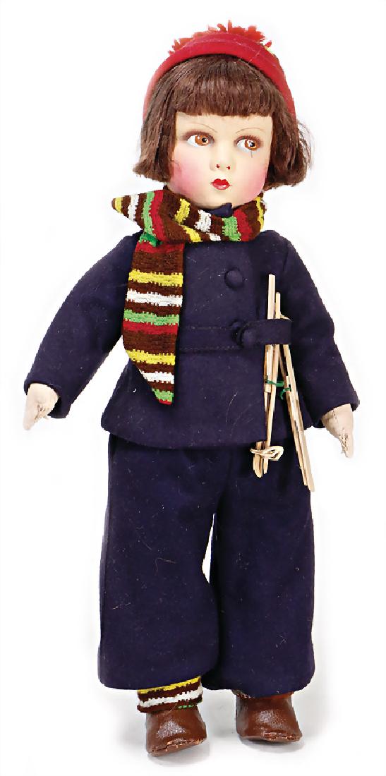 Lenci type, skier, brown, painted, to the side looking (1 of 1)