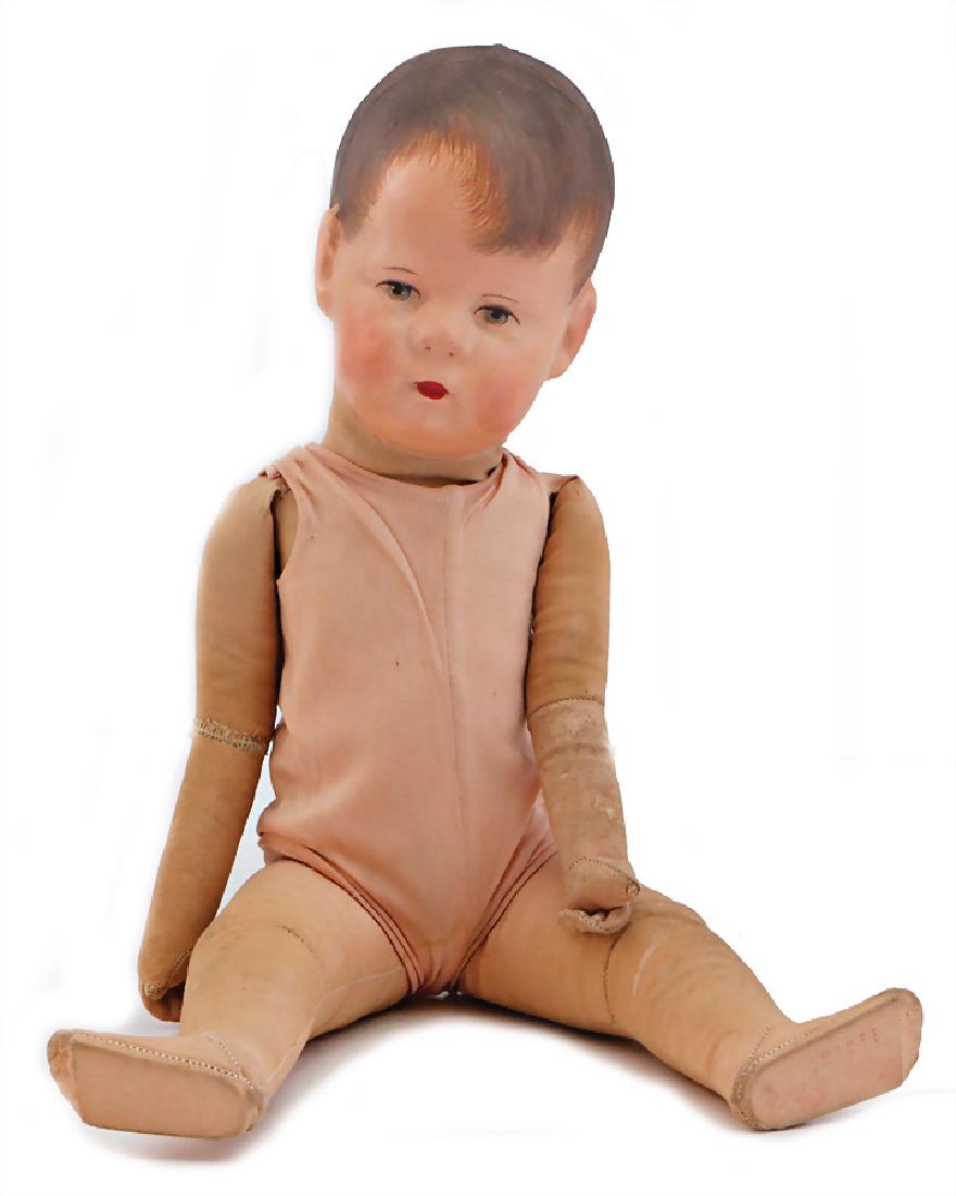 KÄTHE KRUSE late doll No. 1, 3 clearly visible seams at: KÄTHE KRUSE late doll No. 1, 3 clearly visible seams at the back of the head, green painted eyes, dark-brown painted hair, head was colorwise retouched, tricot body is slightly covered in dust, right