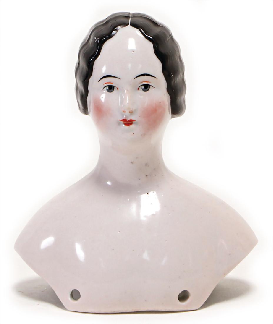 bisque porcelain shoulder headed doll, with deep breast: bisque porcelain shoulder headed doll, with deep breast plate, modelled hair, painted eyes, closed mouth, height: 12.5 cm, German Description Biskuit-Porzellan-Brustblattkopf, mit tief heruntergezogen