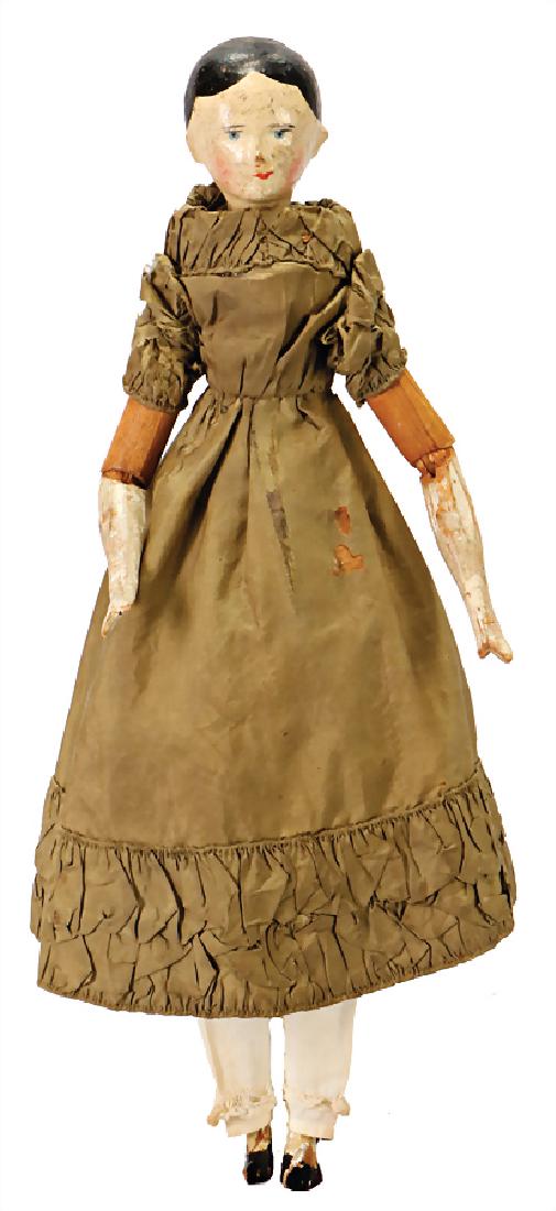 GRÖDNERTAL wood doll, c. 1860, head and hull are: GRÖDNERTAL wood doll, c. 1860, head and hull are carved of one piece, painted hair, stood out nose, blue painted eyes, jointed wood body with 8 ball-and-socket joints, with slim waist, colored arms a