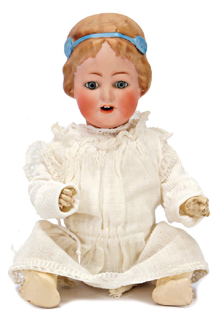 exceptional bisque porcelain character baby, fix inset: exceptional bisque porcelain character baby, fix inset blue glass eyes, opened mouth, upper teeth, modelled hair with hairband, 26 cm, head is slightly loose in the neck pan German Description A
