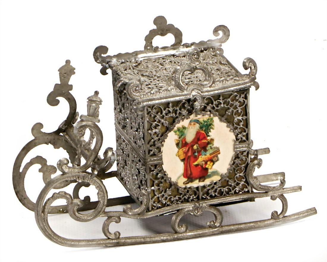 coach, tin, with wafer picture, 14 cm German: coach, tin, with wafer picture, 14 cm German Description Kutsche, Zinn, mit Oblatenbild, 14 cm