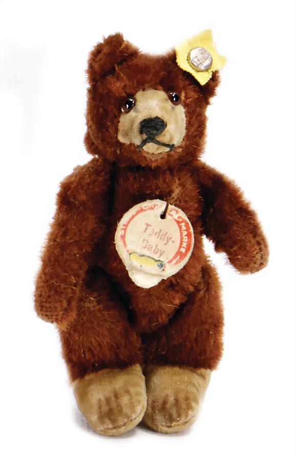 STEIFF teddy-baby, 9 cm, dark-brown, sign with red: STEIFF teddy-baby, 9 cm, dark-brown, sign with red writing (worn), with button, rests of the yellow cloth tag label, good condition German Description STEIFF Teddy-Baby, 9 cm, dunkelbraun, Schild mit 