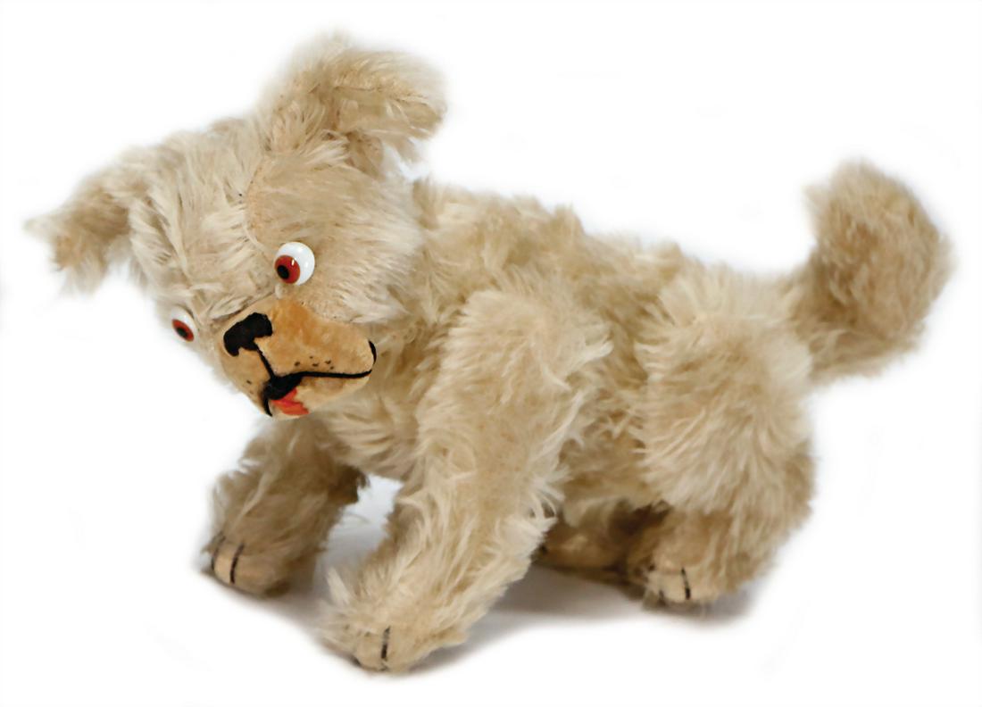 CHUCK VALLEY dog, caricature glass eyes, mohair, felt: CHUCK VALLEY dog, caricature glass eyes, mohair, felt face, swivel head, jointed legs, standing height 18 cm, '30s, a bit mohair loss at 1 cheek, otherwise except of minimally places in good condition
