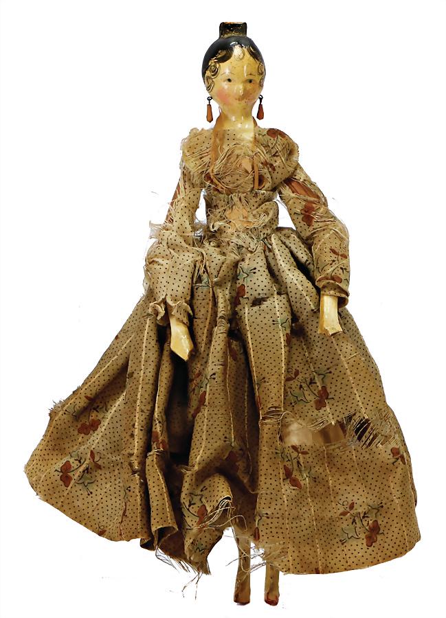 Grödner wood doll c. 1810 , head and hull are made of: Grödner wood doll c. 1810 , head and hull are made of one pieces of carved hardwood , carved comb, sweeping brushstroke, original ear jewellery is made of wood, yellow painted and drop shaped, 8 join