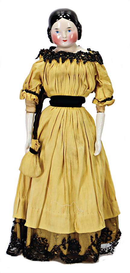 China-Head doll, so-called "Covered Wagon" probably: China-Head doll, so-called "Covered Wagon" probably Kister, c. 1850, deep breast plate with 2 sewing holes, stocky neck, blue eyes, red mouth, black painted modelled hairstyle: white middle parting, v
