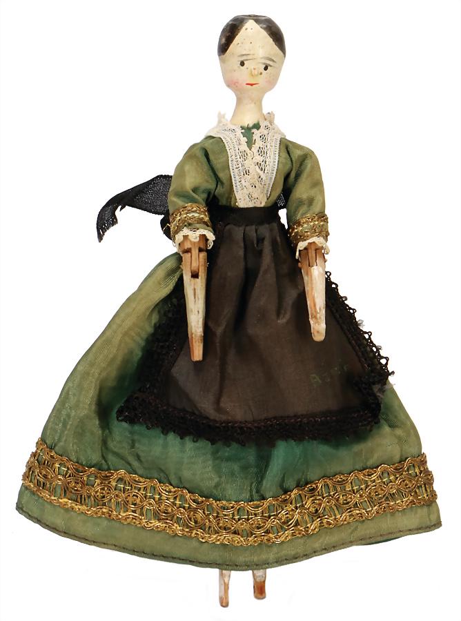 GRÖDNERTAL Grödner doll, head and hull are made of one: GRÖDNERTAL Grödner doll, head and hull are made of one piece of carved wood, , red mouth, black eyes, black painted circular head with middle parting, , body with wood joints with 8 joints, forear