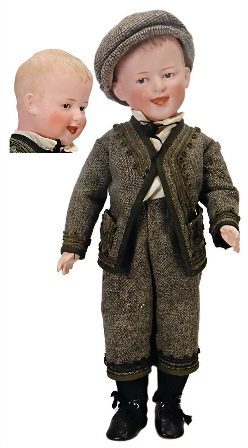 bisque porcelain character boy, not marked, 36 cm,: bisque porcelain character boy, not marked, 36 cm, socket head, modelled hair, dark Intaglio-eyes, opened/closed mouth, teeth and tongue, jointed body, clothes are sewed of old fabric German Descripti